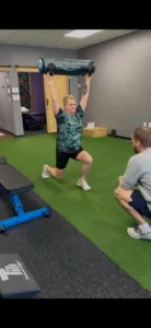Runner doing split squat strength drill at Progressive Mobility in Spartanburg to address hip pain while running